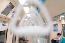 White Handles For Standing Passenger Inside A Metro, Hand Grip Inside City Train Transportation - (selective Focus)