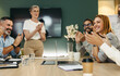 © Jacob Lund - Successful businesspeople applauding during a meeting