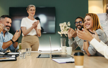 Wall Mural - Successful businesspeople applauding during a meeting