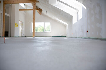 freshly cured concrete screed on construction site in loft in a family house