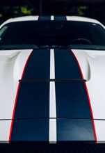 White Car Hood With Black Racing Stripes And Red Pin Stripe