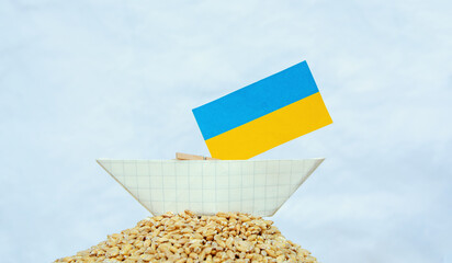 Wall Mural - grain wheat kernel and spikelets on Ukrainian flag background. food problem	
