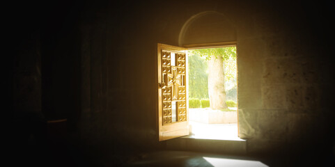 View of opened church wooden door.