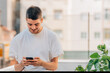 © carballo - young man with mobile phone outdoors