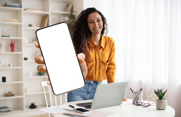 Mobile Offer. Smiling Female Freelancer Showing Big Blank Smartphone At Camera