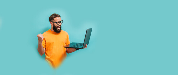 young crazy bearded charismatic man. shocked or surprised expression. laptop concept. funny promotio