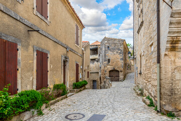 Wall Mural - A typical stone street through the historic medieval village of Les Baux-de-Provence in the Alpilles Mountains of the Provence-Alpes-Cote d'Azur region of Southern France.