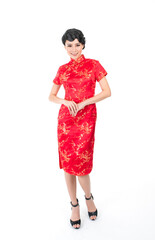 Wall Mural - Portrait of a young asian Chinese female lady model wearing red traditional vintage costume Cheongsam smiling and posing with different poses and gestures 