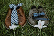 two grooms shoes on grass for wedding