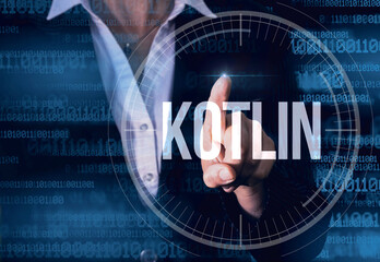 Wall Mural - business woman with finger pressing kotlin button on virtual screens. modern technology concept.