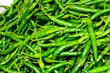 Close up top view of freshly harvested green chillies