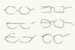 © AJ_stock_photos - hand-drawn doodle set of eyeglass frames on a beige background. vector illustration