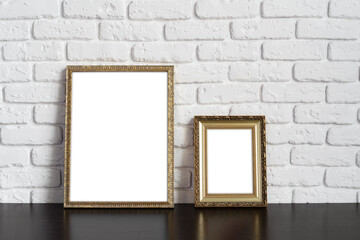 Wall Mural - Blank picture frame against brick wall with copy space