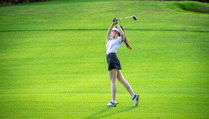 Sticker - Professional woman golfer teeing golf in golf tournament competition at golf course for winner.	