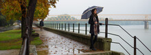 Beautiful Girl With Umbrella Walking Outdoor On A Rainy Misty Autumn Day