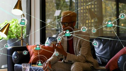 Wall Mural - Animation of network of connections over african american businessman talking on smartphone