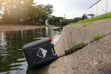 Poster - black chemical tank in industrial canal, leak chemical