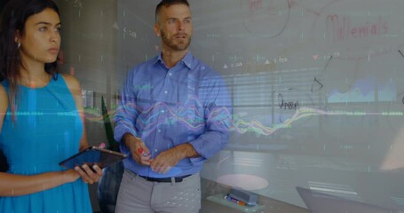 Wall Mural - Animation of financial graphs over diverse businesspeople working in office