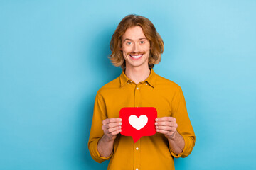 Sticker - Portrait of attractive cheerful long-haired guy holding in hand like card yes chat isolated over bright blue color background