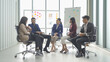 A group of Asian business team talk, communicate, discuss, and work in meeting room office, present ideas to colleagues. People lifestyle. Corporation