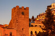 First morning sun beams on San Giuseppe church on square Piazza IX Aprile at sunrise in Taormina, Province of Messina, Sicily, Italy, Europe, EU. St. Augustine Church, Corso Umberto during golden hour