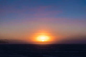 Wall Mural - Winter frozen lake scene in northern Canada on a stunning arctic Canadian landscape in the north. 