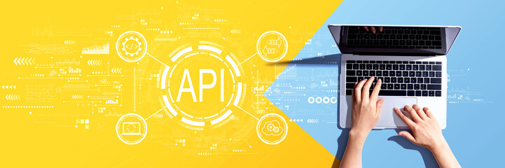 API - application programming interface concept with person using a laptop computer