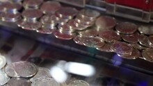 Coin Pusher Machines With A Lot Of Coins