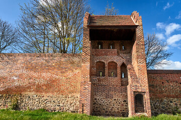 Poster - medieval fortifications with a brick tower and a stone wall in Prenzlau