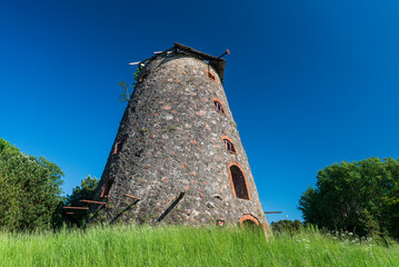 Wall Mural - Abandoned windmill in sunny summer day, Kapsede, Latvia.