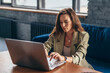 © undrey - Woman at home sitting at desk with laptop