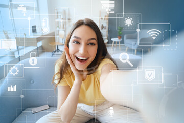 Beautiful happy woman using application of smart home automation in room