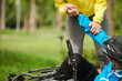 © DragonImages - Cropped image of woman helping man fell from bicycle to get up