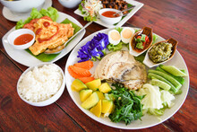 Thai Food Top View Asian Food Served On Wooden Table Setting With Plate Menu In Thailand