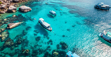 Boats And Crystal Clear Waters At The Bay Dive Site In Koh Tao,diving Tour Boat