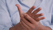 © ronnarong - An Asian man has tingling and numbness in his hand which causes beriberi.