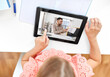 © Syda Productions - school, education and distance learning concept - little student girl with tablet computer having online class at home from top