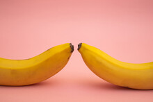 Bright Yellow Bananas On A Pink Background