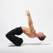 © Alexander Y - modern ballet male dancer posing over white studio background