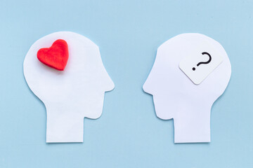 Wall Mural - Brain and heart. Logic and emotion communication concept with two paper heads