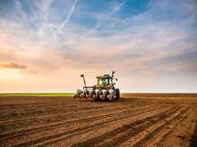 Tractor Drilling Seeding Crops At Farm Field. Agricultural Activity.