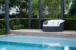 © Pornpawit - Modern sofa and furniture with pool.