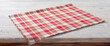 Folded towel, linen tablecloth on wooden desk perspective. Selective focus.