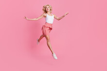 Full Length Body Size View Of Attractive Trendy Cheerful Slender Girl Jumping Running Isolated Over Pink Pastel Color Background
