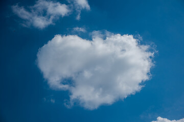 Wall Mural - white cloud heart shape on blue sky for love concept