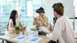 © Prathankarnpap - Businessman wearing virtual reality headset at business meeting. Teamwork, startup, innovation concept