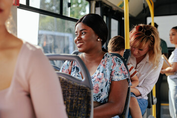 Wall Mural - Young black woman in public transport