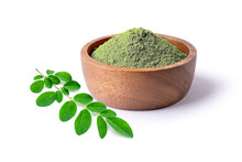 Moringa Leaf (Moringa Oleifera) And Moringa Powder In Wooden Bowl Isolated On White Background.