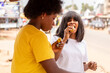 © Confidence - african women eating roasted plantain