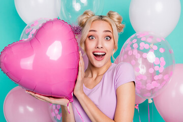 Poster - Photo of sweet young blond lady with balloons wear pink t-shirt isolated on teal background